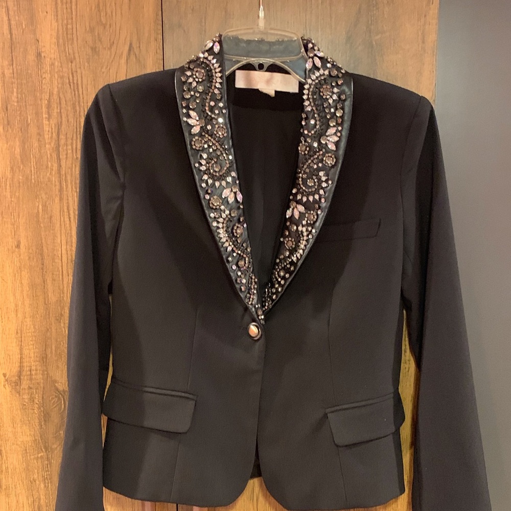 Black bolero style jacket with intricately beaded lapel